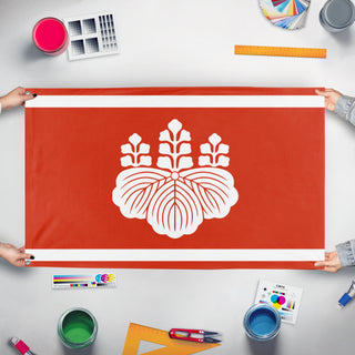 A mockup of the custom flag 'Hashiba Clan flag' held up on a table during print checking