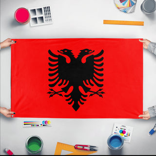 A mockup of the custom flag 'HighContrastFlag' held up on a table during print checking