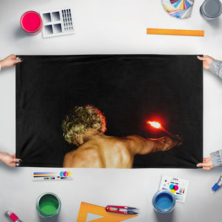 A mockup of the custom flag 'ISOxo flag' held up on a table during print checking