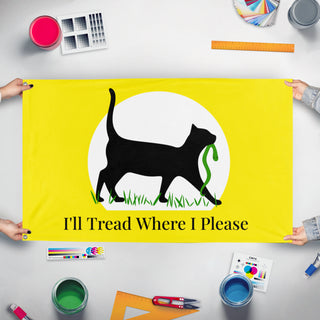 A mockup of the custom flag 'I'll Tread Where I Please flag' held up on a table during print checking