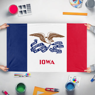 A mockup of the custom flag 'Iowa State Flag' held up on a table during print checking