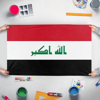 A mockup of the custom flag 'Iraq flag' held up on a table during print checking