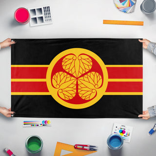 A mockup of the custom flag 'Japanese Shogunate Flag' held up on a table during print checking