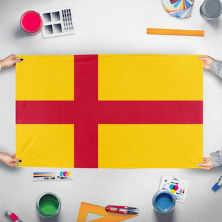 A mockup of the custom flag 'Kalmar Union flag' held up on a table during print checking