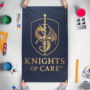 A mockup of the custom flag 'Knights of Care Vertical flag' held up on a table during print checking