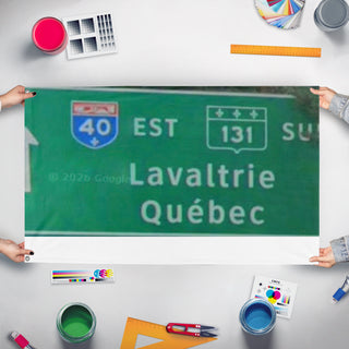 A mockup of the custom flag 'Lavaltrie flag' held up on a table during print checking