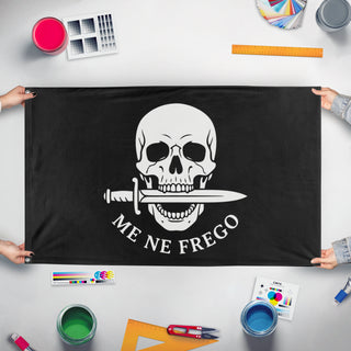 A mockup of the custom flag 'Me Ne Frego flag' held up on a table during print checking