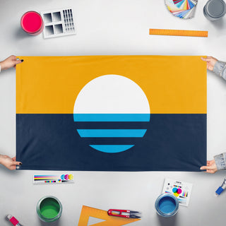 A mockup of the custom flag 'Milwaukee People's Flag' held up on a table during print checking