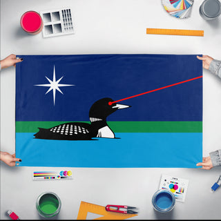 A mockup of the custom flag 'Minnesota Laser Loon flag' held up on a table during print checking