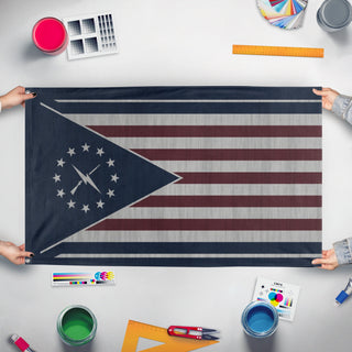 A mockup of the custom flag 'Minutemen Flag' held up on a table during print checking