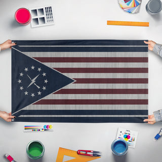 A mockup of the custom flag 'Minutemen Flag Vertical' held up on a table during print checking