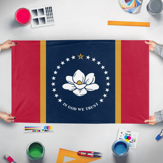 A mockup of the custom flag 'Mississippi State Flag' held up on a table during print checking