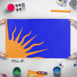 A mockup of the custom flag 'Modern Irish Sunburst flag' held up on a table during print checking