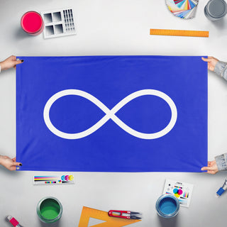 A mockup of the custom flag 'Métis Nation Flag' held up on a table during print checking
