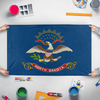 A mockup of the custom flag 'North Dakota State Flag' held up on a table during print checking