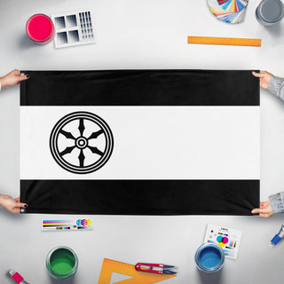 A mockup of the custom flag 'Osnabrück Flag' held up on a table during print checking