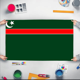 A mockup of the custom flag 'Pakistan empire flag' held up on a table during print checking