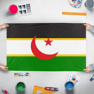 A mockup of the custom flag 'Proposal Flag for Western Sahara' held up on a table during print checking