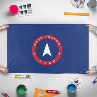 A mockup of the custom flag 'Provisional Republic of Free Joseon flag' held up on a table during print checking