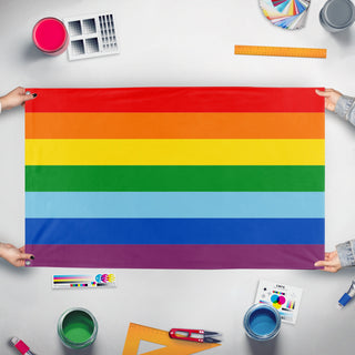 A mockup of the custom flag 'Quechuas of Bolivia and Peru Flag' held up on a table during print checking