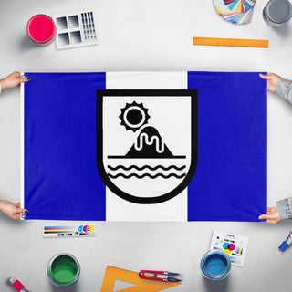 A mockup of the custom flag 'Republic of Paladonia flag' held up on a table during print checking