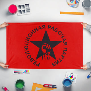 A mockup of the custom flag 'Revolutionary Worker's Party flag' held up on a table during print checking