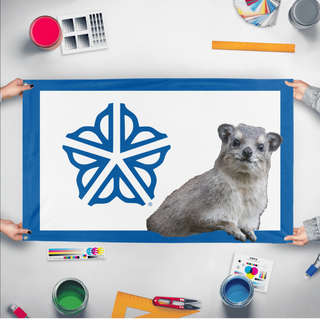 A mockup of the custom flag 'RocHyrax flag' held up on a table during print checking