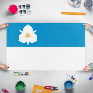 A mockup of the custom flag 'Salt Lake City Flag' held up on a table during print checking