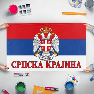 A mockup of the custom flag 'Serbian Krajina flag' held up on a table during print checking