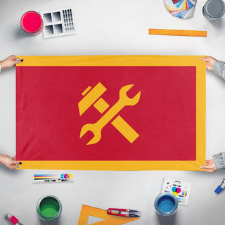 A mockup of the custom flag 'Socialist/Communist Banner flag' held up on a table during print checking