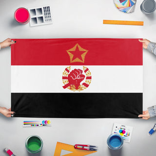 A mockup of the custom flag 'Socialist Egypt Flag' held up on a table during print checking
