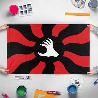 A mockup of the custom flag 'Spanish Nationalist Syndicalist Party flag' held up on a table during print checking