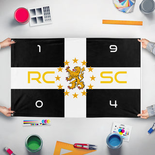 A mockup of the custom flag 'Sporting Charleroi flag' held up on a table during print checking