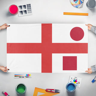 A mockup of the custom flag 'T flag' held up on a table during print checking