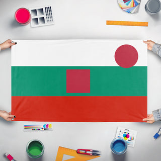 A mockup of the custom flag 'T flag' held up on a table during print checking