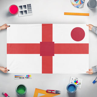 A mockup of the custom flag 'T flag' held up on a table during print checking
