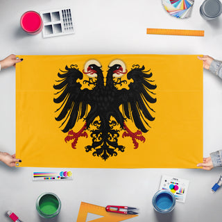 A mockup of the custom flag 'Tali flag' held up on a table during print checking