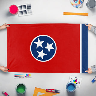 A mockup of the custom flag 'Tennessee State Flag' held up on a table during print checking