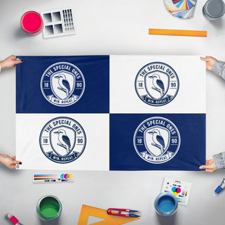 A mockup of the custom flag 'The Special Ones FC flag' held up on a table during print checking