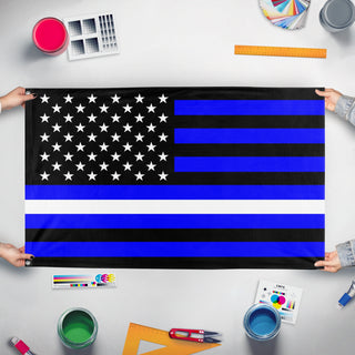 A mockup of the custom flag 'Thin White Line Flag' held up on a table during print checking