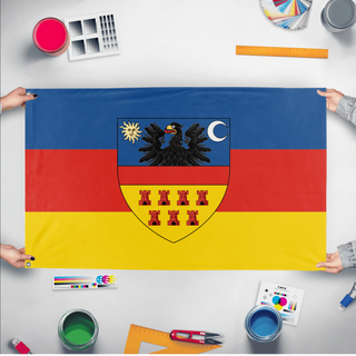 A mockup of the custom flag 'Transylvania flag' held up on a table during print checking