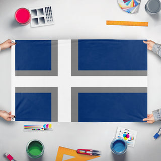 A mockup of the custom flag 'UMF flag' held up on a table during print checking