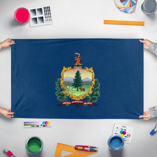 A mockup of the custom flag 'Vermont State Flag' held up on a table during print checking