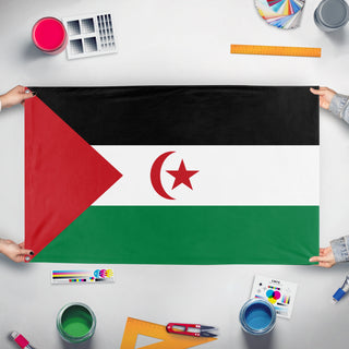 A mockup of the custom flag 'Western Sahara Flag' held up on a table during print checking