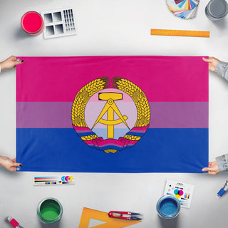 A mockup of the custom flag 'biseuxal ddr flag' held up on a table during print checking