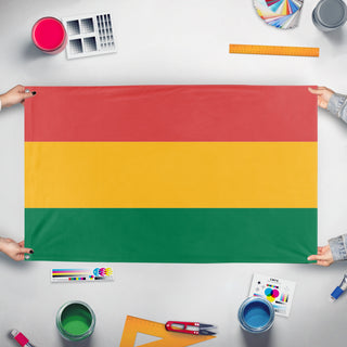 A mockup of the custom flag 'bolivia flag' held up on a table during print checking