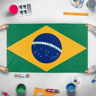 A mockup of the custom flag 'brasil flag' held up on a table during print checking