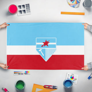 A mockup of the custom flag 'bremar flag' held up on a table during print checking
