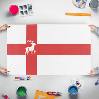 A mockup of the custom flag 'caidenia flag' held up on a table during print checking