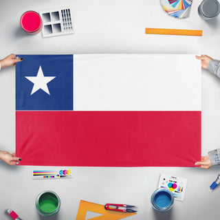 A mockup of the custom flag 'chile flag' held up on a table during print checking